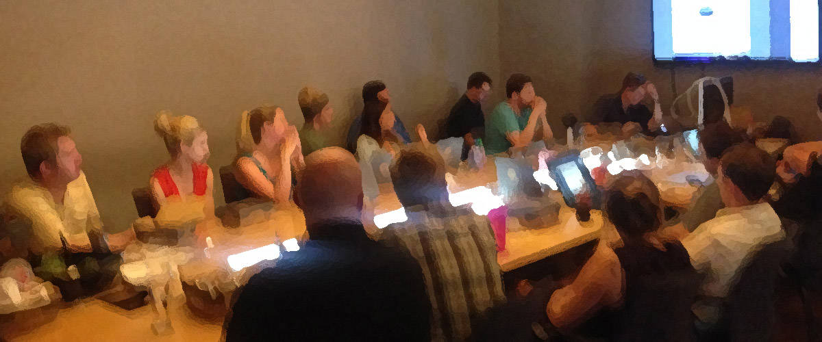 Blurred photo of a team meeting in a conference room.
